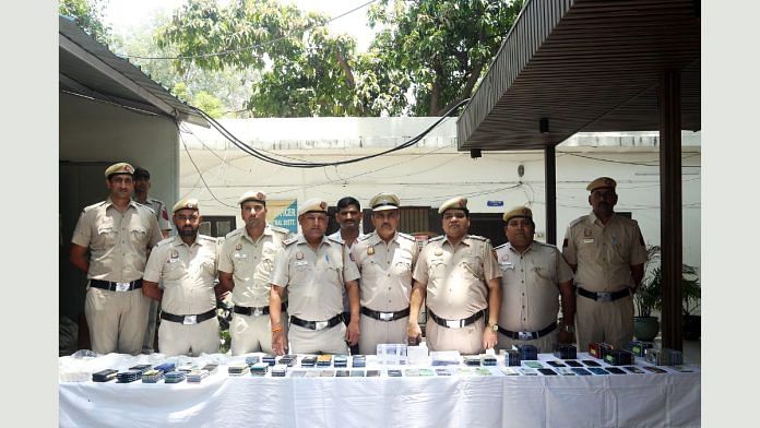 Delhi police personnel addresses a press conference Monday after nabbing the cross-country nexus | ANI