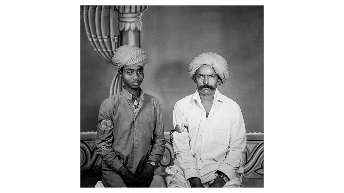 Untitled, (Seated Portrait of Two Train Porters), Suresh Punjabi, Suhag Studio, Nagda, Madhya Pradesh, c. 1984, Celluloid negative. | Museum of Art and Photography (MAP), Bengaluru