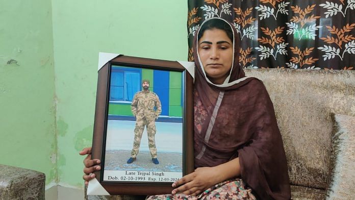 Tejpal Singh's wife Parminder Kaur sits with his photograph in Russian uniform | Shubhangi Misra, ThePrint