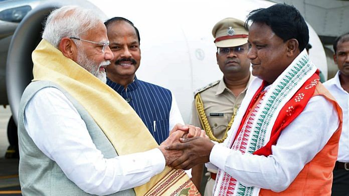 Prime Minister Narendra Modi being welcomed by Odisha Chief Minister-designate Mohan Charan Majhi on his arrival, at Biju Patnaik International Airport, in Bhubaneswar on Wednesday | ANI Photo