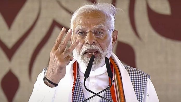 Prime Minister Narendra Modi addresses the gathering at the Kisan Samman Sammelan, in Varanasi on Tuesday | PTI Photo