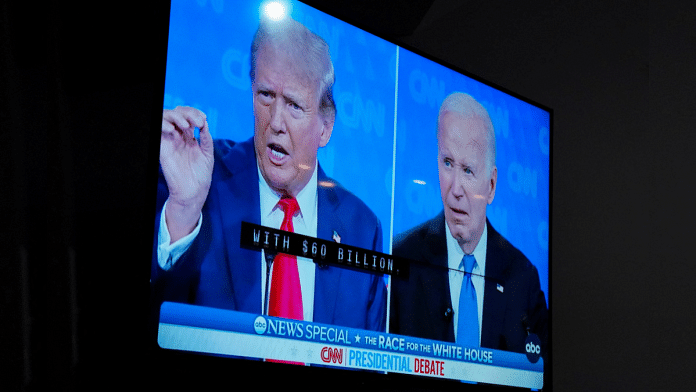 A TV screen shows the Presidential debate debate U.S. President Joe Biden and former U.S. President Donald Trump face-off in the first debate ahead of 2024 election. File Photo | Reuters/Allison Joyce
