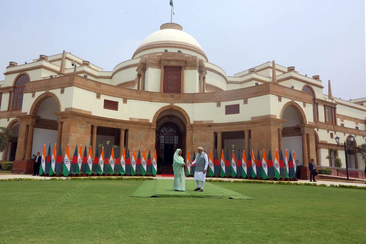 Prime Minister Narendra Modi with his Bangladeshi counterpart Sheikh Hasina shaking hand at Hyderabad House | Praveen Jain | ThePrint