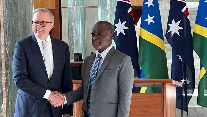 Solomon Islands Prime Minister Jeremiah Manele shakes hands with Australia Prime Minister Anthony Albanese in Australia’s national parliament, on his first visit to Australia since winning a national election, in Canberra, Australia, June 26, 2024. REUTERS/Kirsty Needham