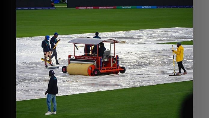 Groundsmen sweep water from the covers as rain delays the start of the men's T20 World Cup cricket match between Sri Lanka and Nepal at Central Broward Regional Park Stadium, Lauderhill, Florida on Tuesday | AP/PTI