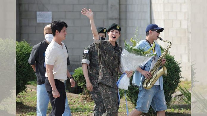 K-pop boy band BTS member Jin leaves after being discharged from the military in Yeoncheon, South Korea on 12 June | Reuters/Yonhap