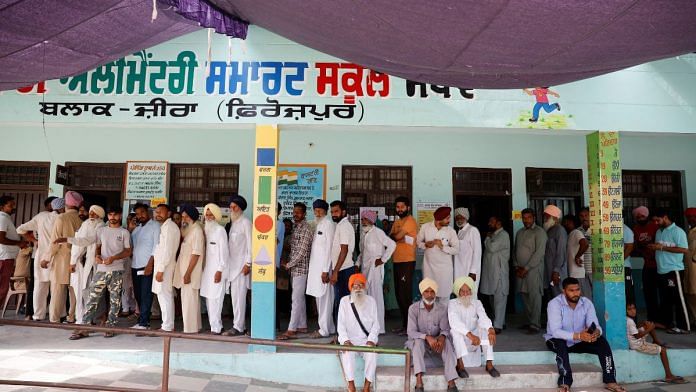 Voters stand in line to cast their votes at a polling station during the seventh and last phase of the general election, at a village in Firozpur district, Punjab on 1 June 2024 | Reuters/Adnan Abidi