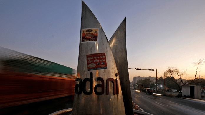 Logo of the Adani Group installed at a roundabout on the ring road in Ahmedabad | File Photo | Reuters | Amit Dave