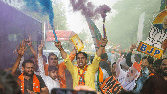 BJP workers celebrate outside party HQ in New Delhi, Tuesday | Suraj Singh Bisht | ThePrint
