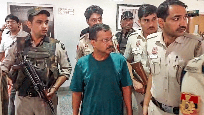 Arvind Kejriwal being brought out of the courtroom for tea and biscuits after his sugar level dropped, at Rouse Avenue Court in New Delhi on 26 June | PTI