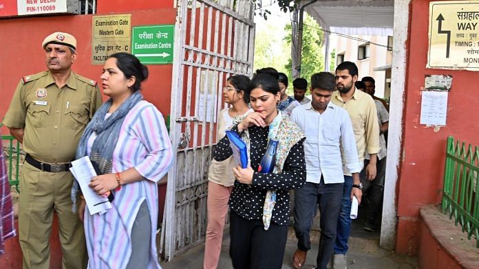 Aspirants leave the examination centre after appearing for the UPSC Civil Services (Preliminary) exams in New Delhi on Sunday. | ANI