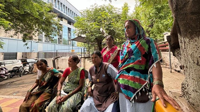 Vijaya Chavan, Surekha Waghmare, Vijaymala Salve, Manisha Hira Borade, Sunita Dake (left to right) at the PCMC canteen. The blue municipal corporation building stands behind them. | Vandana Menon | ThePrint