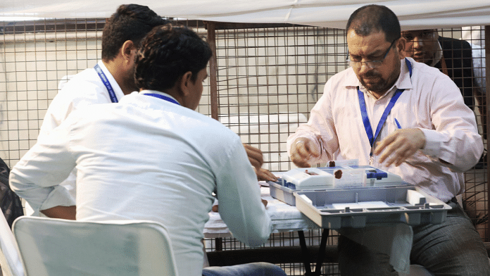 Poll officials at a counting centre in New Delhi | Manisha Mondal | The Print