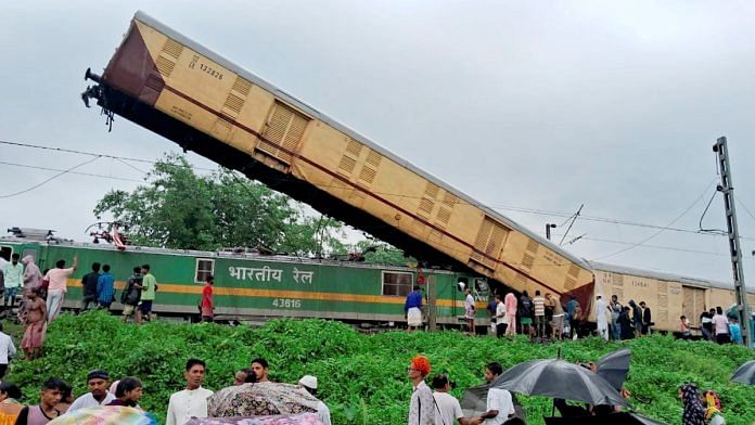 Locals gather after the Kanchanjunga Express collided with a goods train, near New Jalpaiguri railway station, on Monday, June 17, 2024 | PTI