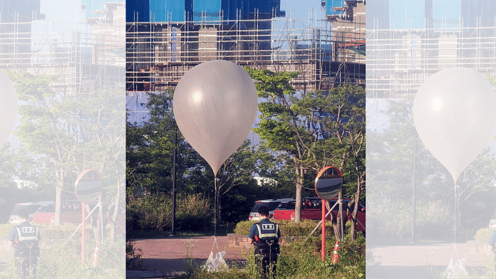 A balloon believed to have been sent by North Korea, carrying various objects including what appeared to be trash, is pictured at a park in Incheon, South Korea, 2 June 2024 | Yonhap via Reuters