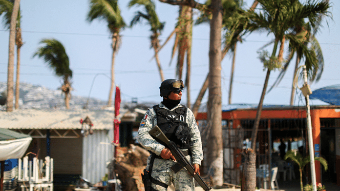A member of the National Guard stands guard at a crime scene where two people were shot in Acapulco, Mexico on 7 May 2024. There have been 37 murders of electoral candidates in Mexico in 2024 alone | Representative Image | Reuters