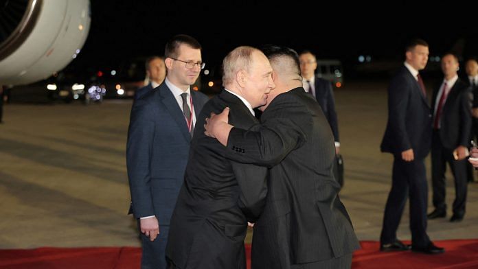 Russian President Vladimir Putin embraces North Korean leader Kim Jong Un upon his arrival at an airport in Pyongyang, North Korea, in this image released by the Korean Central News Agency June 19, 2024 | KCNA via Reuters