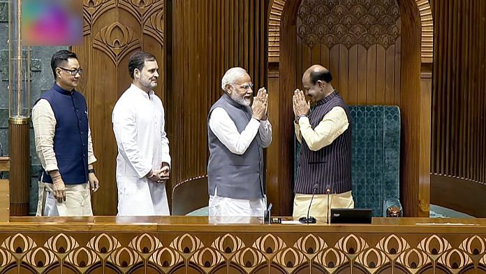 Prime Minister Narendra Modi, LoP Rahul Gandhi and Union Minister Kiren Rijiju accompany newly elected Lok Sabha Speaker Om Birla to the chair, at Parliament House in New Delhi Wednesday | ANI/SansadTV