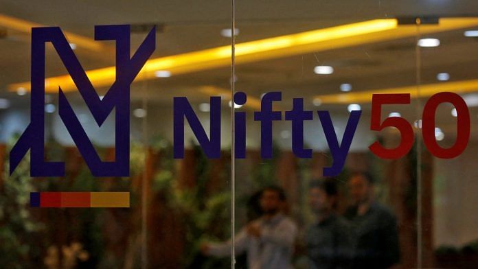 People walk past a new brand identity for Nifty Indices inside the National Stock Exchange (NSE) building in Mumbai, India, May 28, 2019 | Reuters file photo