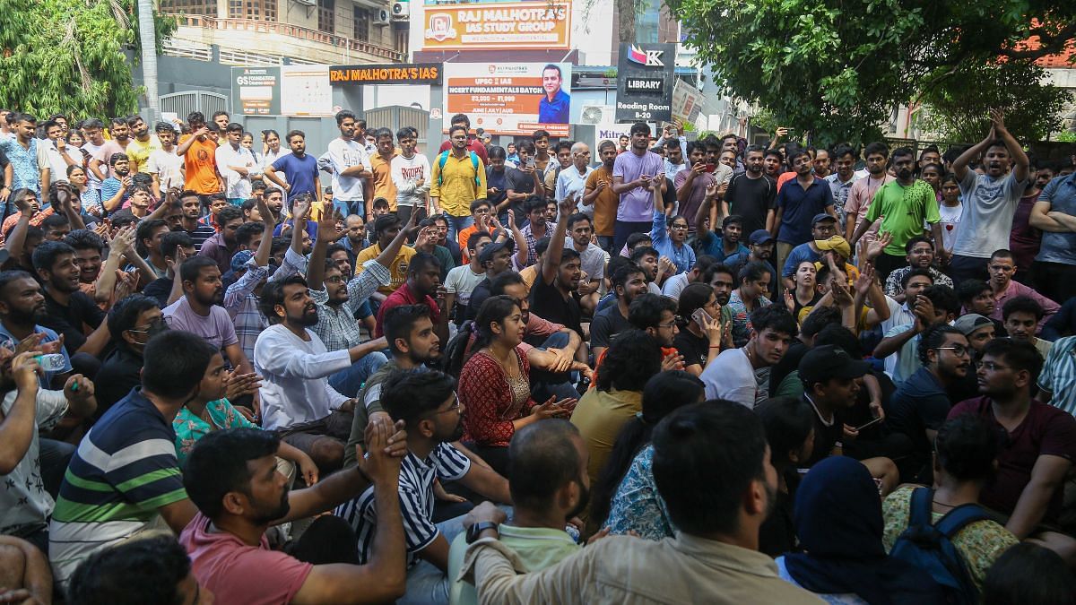 Students stage protest after the death of three UPSC aspirants inside Rau's Study Circle's basement library | Suraj Singh Bisht, ThePrint