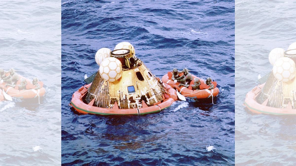 Apollo 11 crew and a Navy diver await pickup after splashdown | Photo: Wikimedia Commons