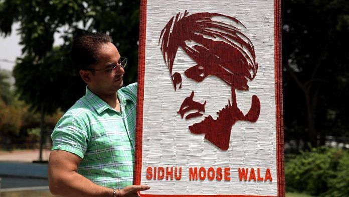 An artist shows a portrait of slain Punjabi singer Sidhu Moosewala prepared using toothpicks | Photo: ANI