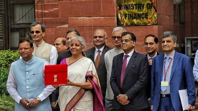 Union Finance Minister Nirmala Sitaraman with her team with at Ministry of Finance in New Delhi, Tuesday | Praveen Jain | ThePrint