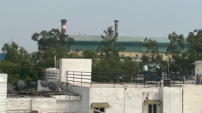 Okhla waste-to-energy plant as seen from roof of a house in Sukhdev Vihar DDA flats | Devangi Jain