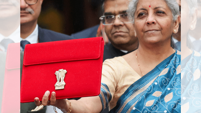 India's Finance Minister Nirmala Sitharaman holds up a folder with the Government of India's logo | File photo | Reuters/Anushree Fadnavis