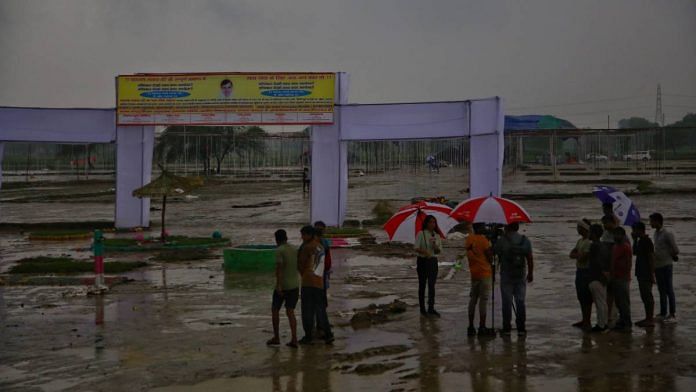 People clear the stampede site in Hathras | Photo: Manisha Mondal/ThePrint