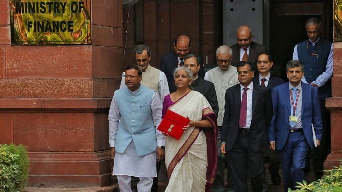 Finance Minister Nirmala Sitharaman and her team with the Budget tablet outside the Ministry of Finance | Photo: Praveen Jain, ThePrint
