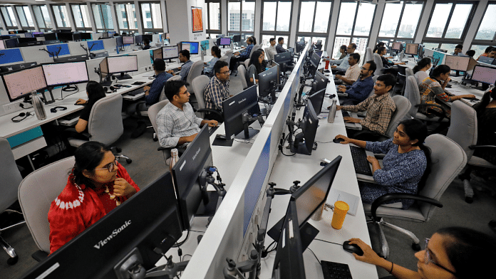Employees work on their terminals inside the office of Manubhai & Shah LLP, a local accounting firm, in Ahmedabad | Reuters | Amit Dave | File Photo