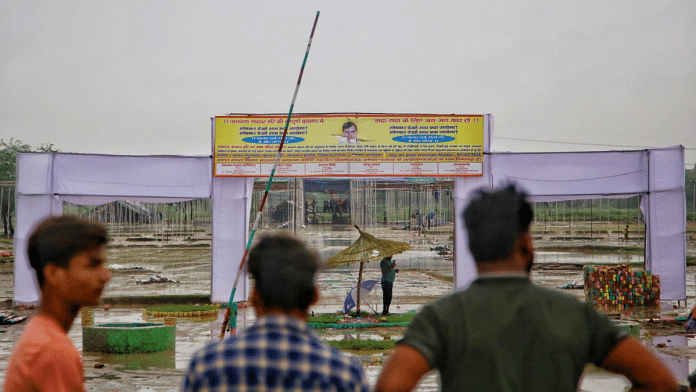 Onlookers at the site of satsang venue where the stampede took place Tuesday | Manisha Mondal | ThePrint