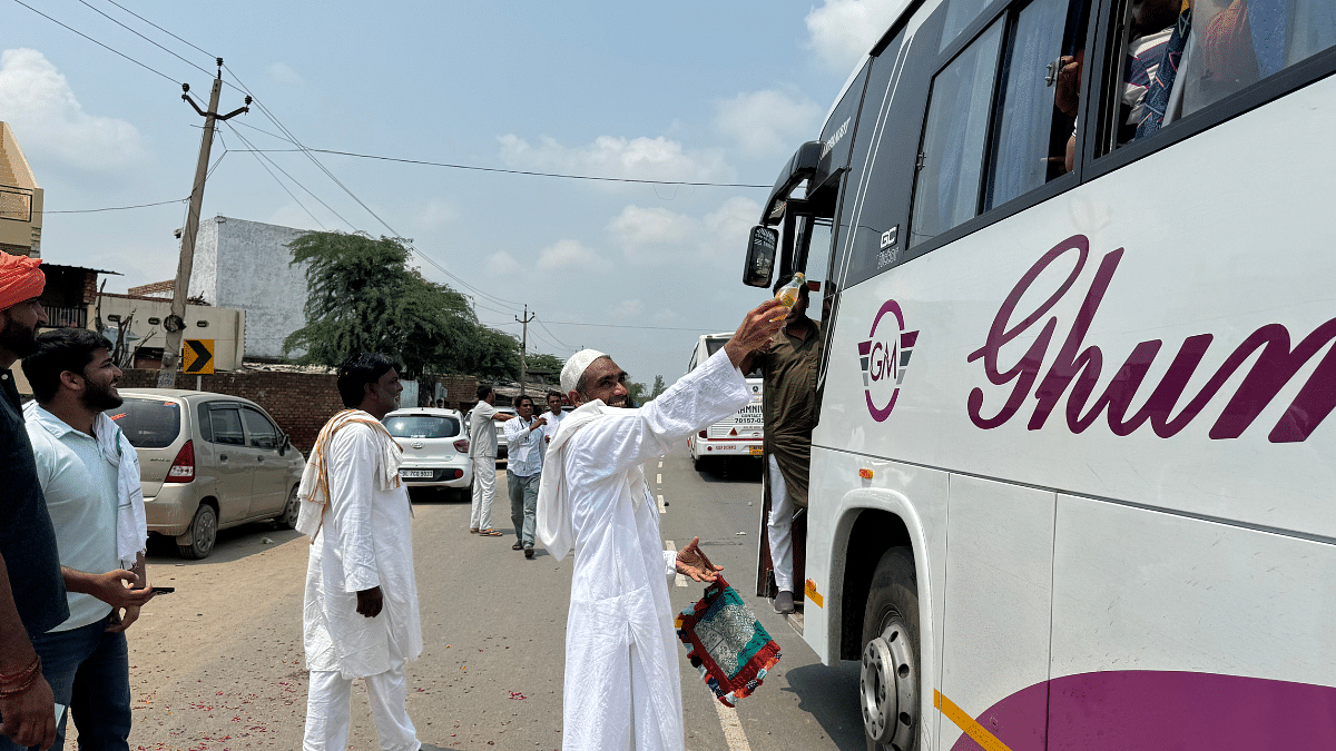 A Muslim man hands out refreshments to people participating in Brij Mandal Yatra on Monday | Sagrika Kissu | ThePrint