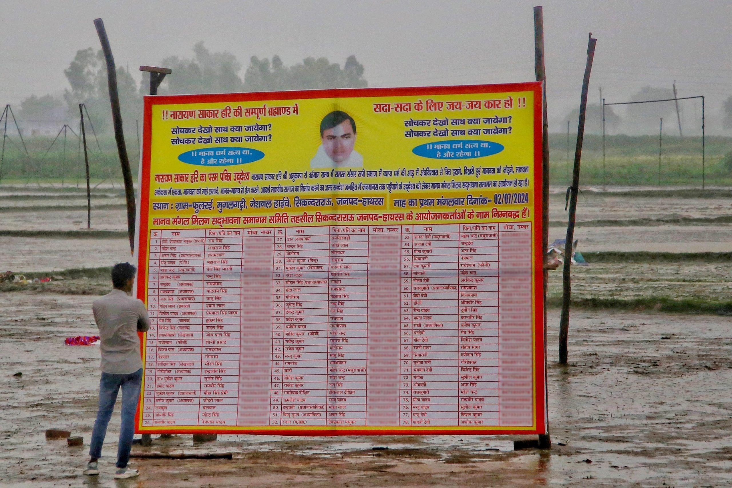 A board displaying purported names of the satsang organisers, at the venue in Fulrai village where at least 121 people were killed in a stampede Tuesday | Manisha Mondal | ThePrint