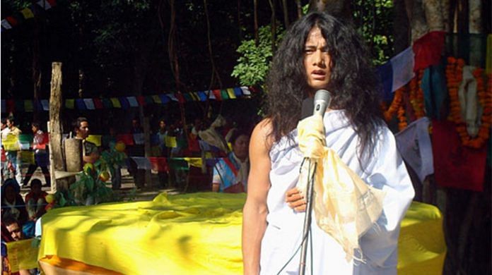 Seventeen-year-old Ram Bahadur Bamjon speaks to devotees from nearby villages in remote forest in Ratanpur | Reuters