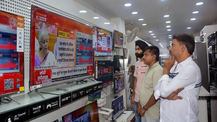 People watch the live telecast of Union Budget 2024-25