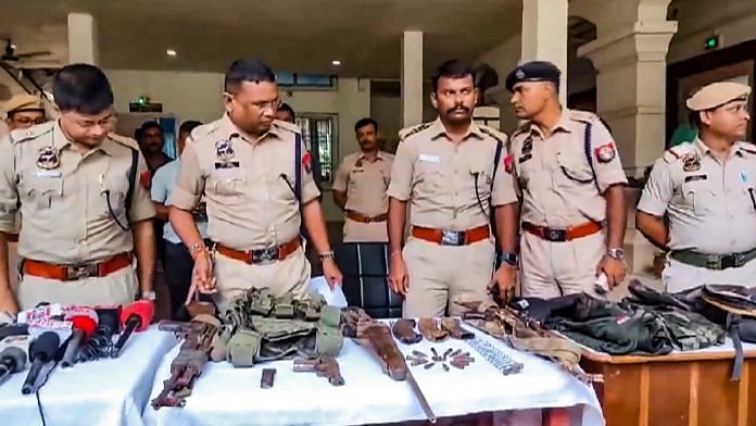 Police personnel display the arms and ammunition recovered after an encounter with alleged Hmar terrorists, in Cachar district of Assam, Wednesday, July 17, 2024. At least 3 militants were killed in the encounter, according to officials | PTI