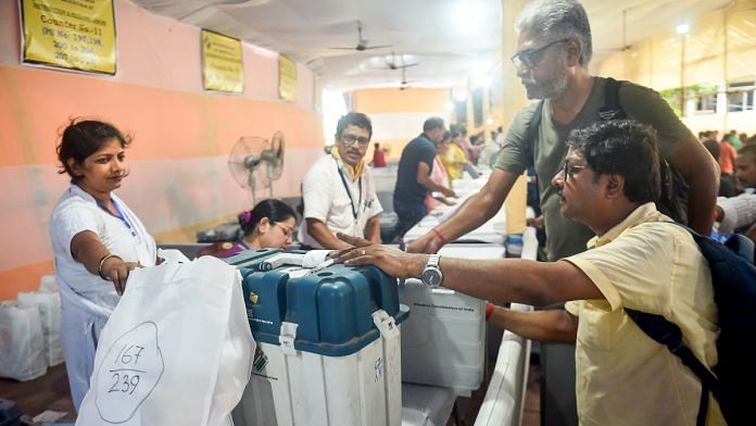 Polling officials collect EVM and other election materials at a distribution centre for the Maniktala Assembly bypoll, in Kolkata, Tuesday, July 9, 2024 | PTI