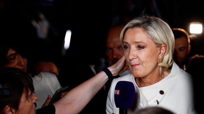 French far-right leader Marine Le Pen talks to journalists after partial results in the second round of the early French parliamentary elections, at the French far-right Rassemblement National (National Rally - RN) party venue in Paris, France, July 7, 2024 | Reuters file photo