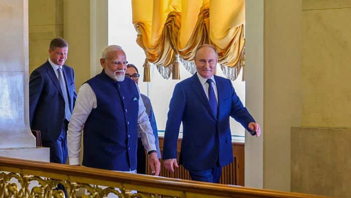Prime Minister Narendra Modi and Russian President Vladimir Putin arrive for a meeting at the Kremlin, in Moscow, Russia | PTI