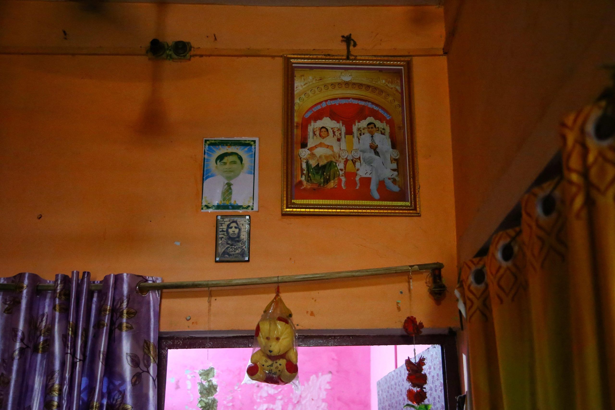 Godman Bhole Baba's picture hangs on a wall in Ramsevak and Radha Rani home | Manisha Mondal | ThePrint