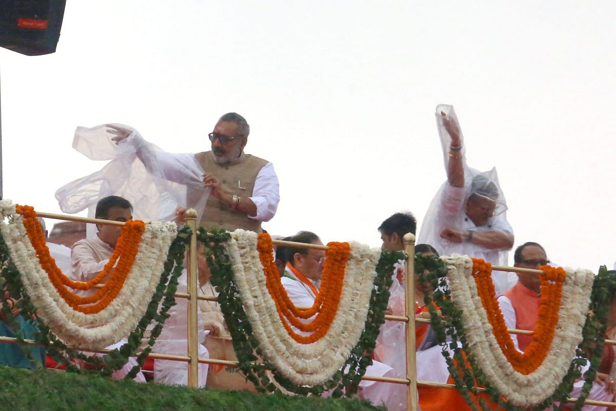 Union Minister Giriraj Singh wearing rain cover | Praveen Jain | ThePrint