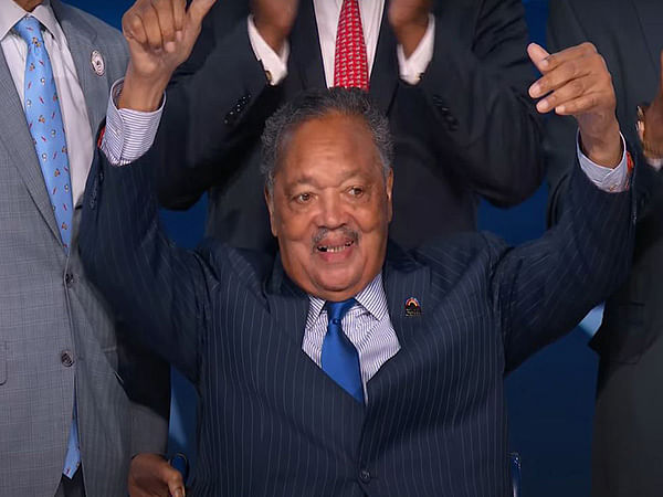 US civil rights activist Jesse Jackson makes surprise appearance at Democratic Convention, receives emotional tribute