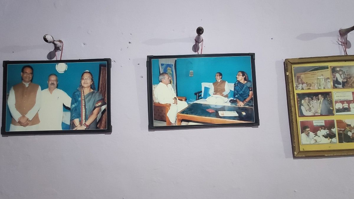 Walls of Nand Kishore Sharma's home with pictures of him seated with former CM Shivraj Singh Chouhan | Iram Siddique | ThePrint