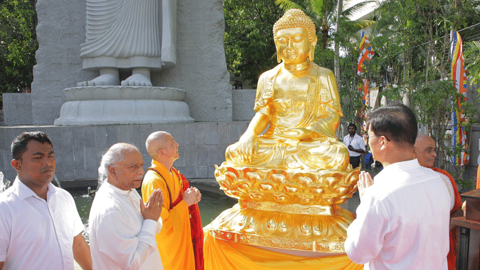 Sri Lankan PM Dinesh Gunawardena presents a Buddha statue donated by the White Horse Temple in China | Credit: X/@DCRGunawardena