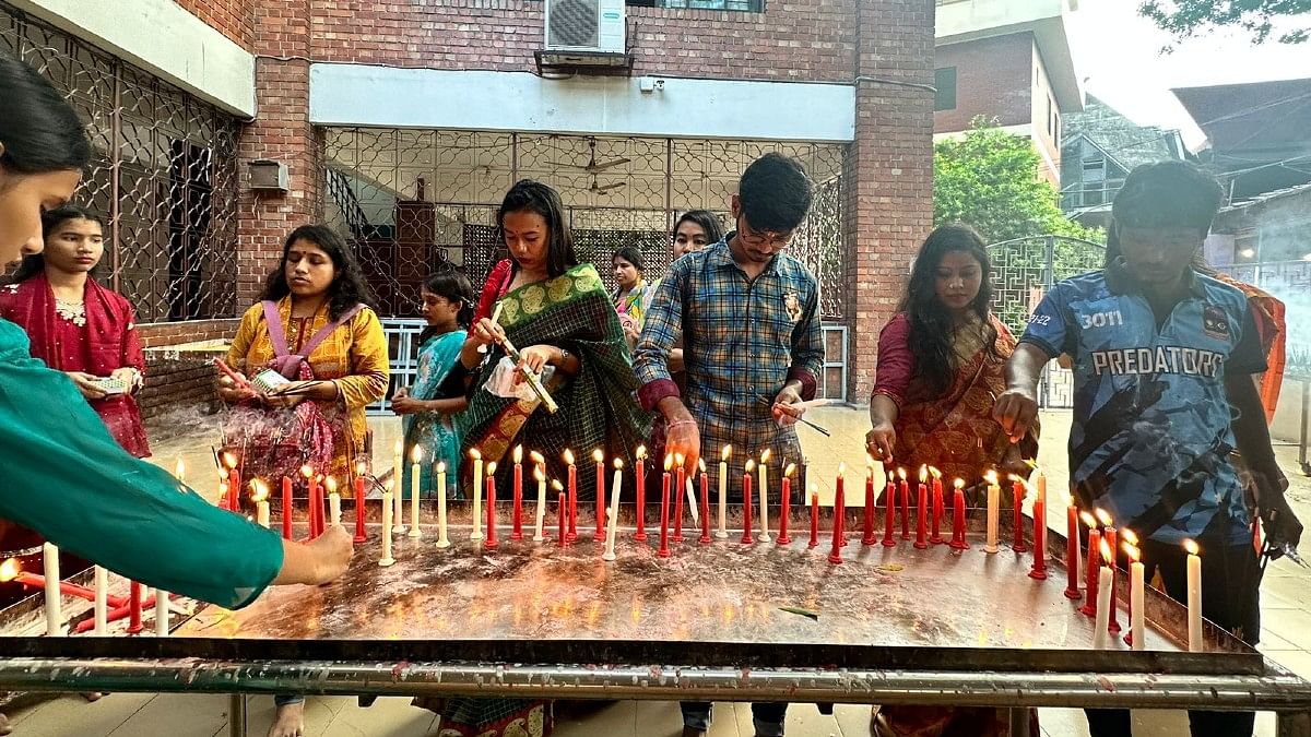 Devotees lighting candles at Dhakeshwari temple, Monday | Ananya Bhardwaj | ThePrint