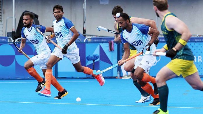 Players vie for the ball during the men’s hockey Pool B match between India and Australia Friday at the Paris Olympics 2024. India beat Australia by 3-2 | Photo: ANI