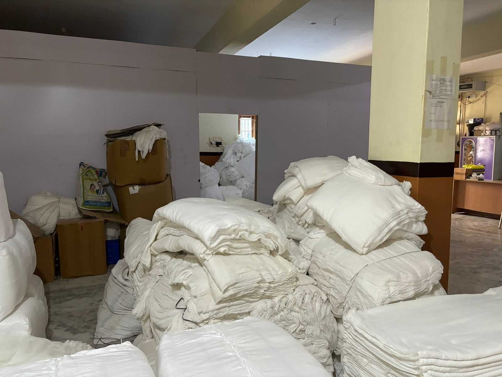 Heaps of white cloth at a workshop | Vandana Menon, ThePrint