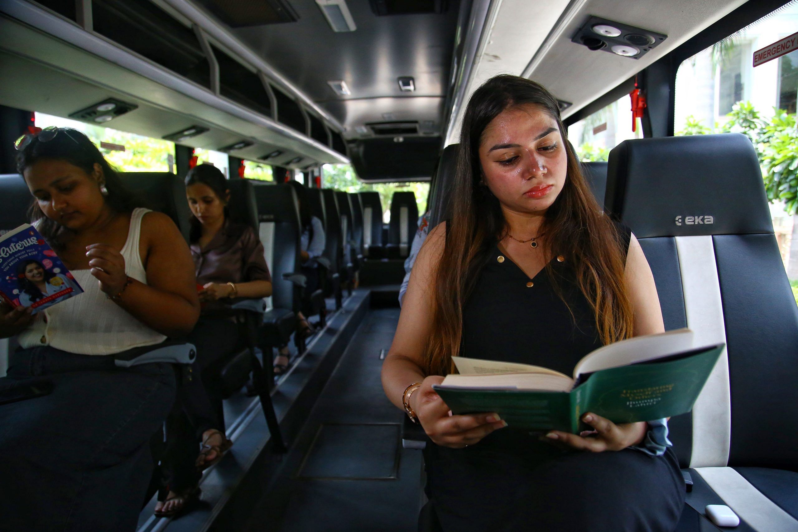 Passengers reading in Uber vehicle | Manisha Mondal, ThePrint